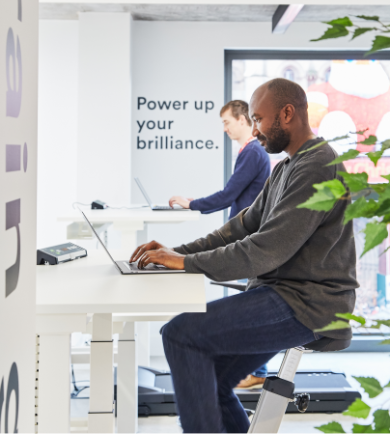 People working at tall desks